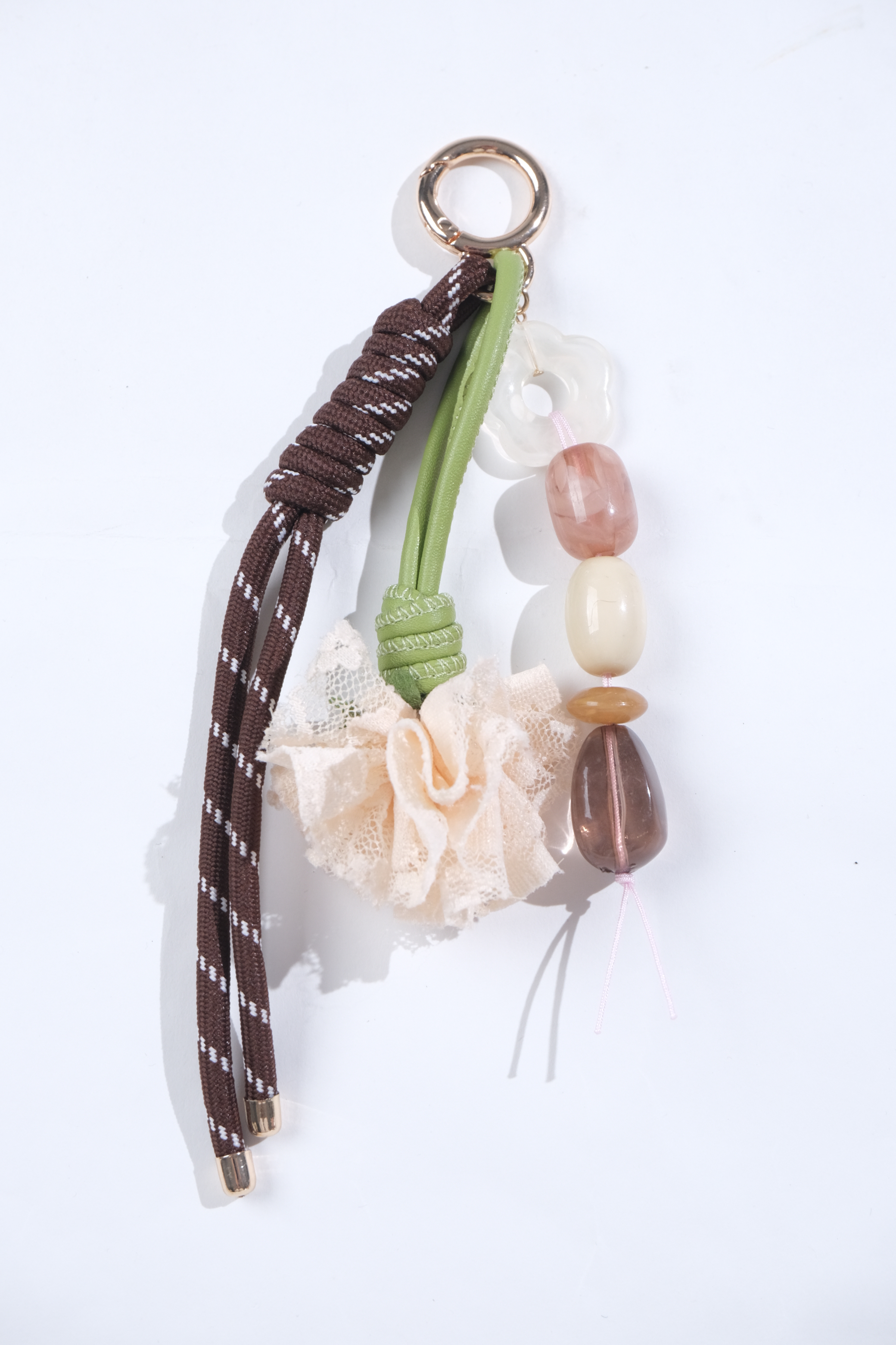 Bag charm with cords, beads and fabric flower