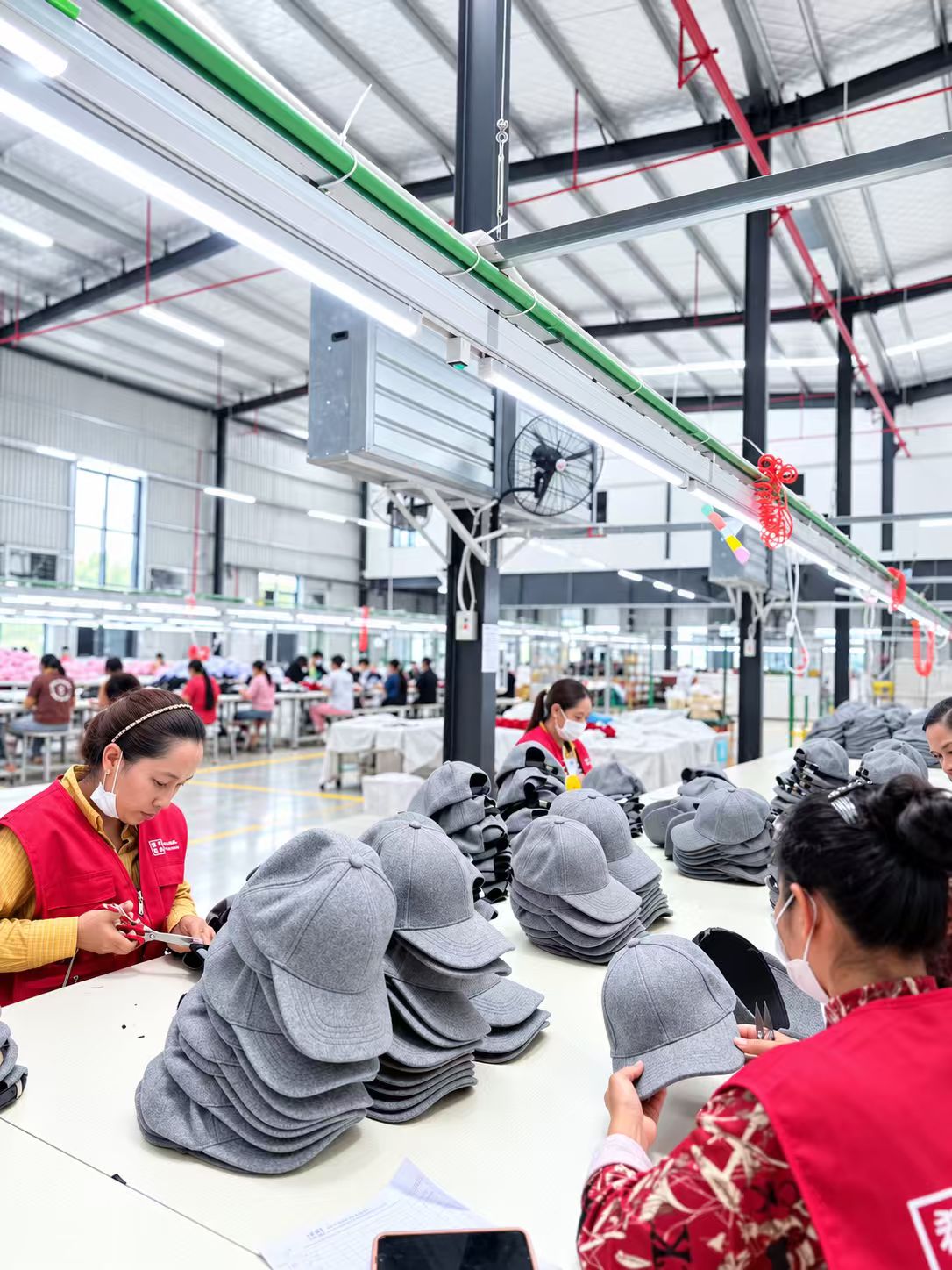 Cambodia partner factory — headwear finishing